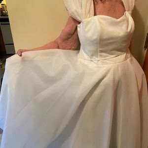Custom made wedding dress. Brand New. Never worn except for pictures.